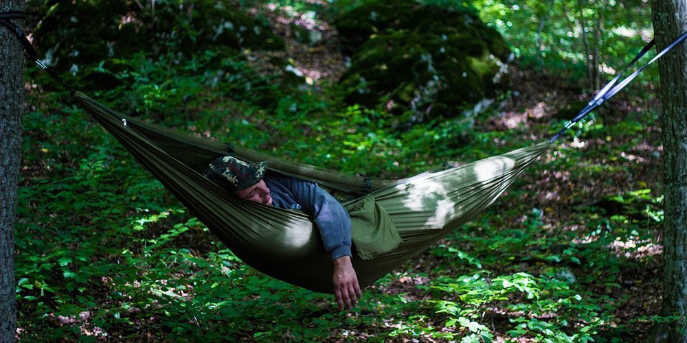 Person sleeping in a hammock