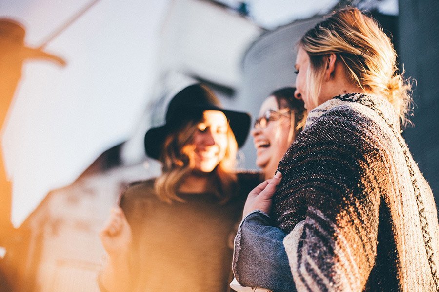 Friends laughing outdoors