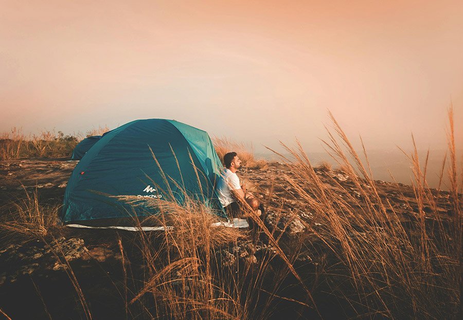 Man camping with a tent