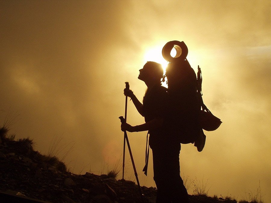 Woman trekking with poles