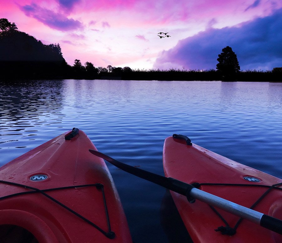 Kayaks with night falling