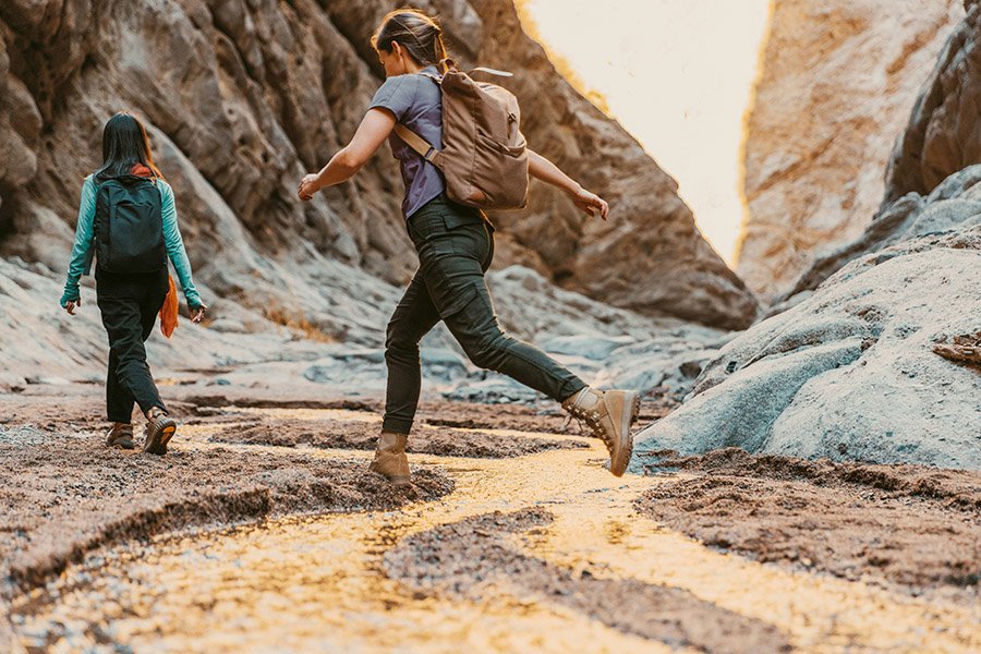 Hiker crossing a stream